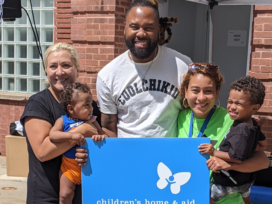 Gigi with the Children's Home & Aid team and families at a community event